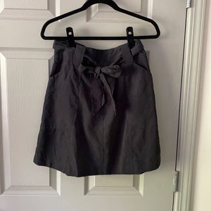 Above the knee black skirt with tie waist
